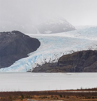 Tidewater glacier meeting the sea in Alaska