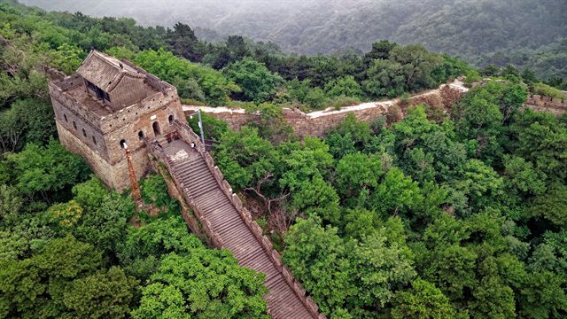 The Great Wall of China winding through green hills near Beijing